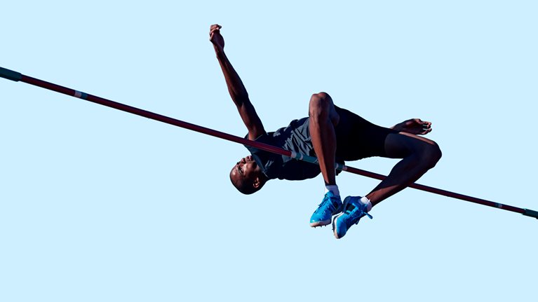 Male athlete doing high jump